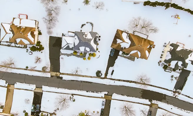 aerial view of cheektowaga styled houses with snowy roof tops