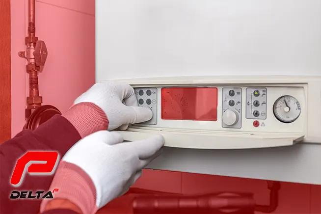 technician fixing a boiler on delta p